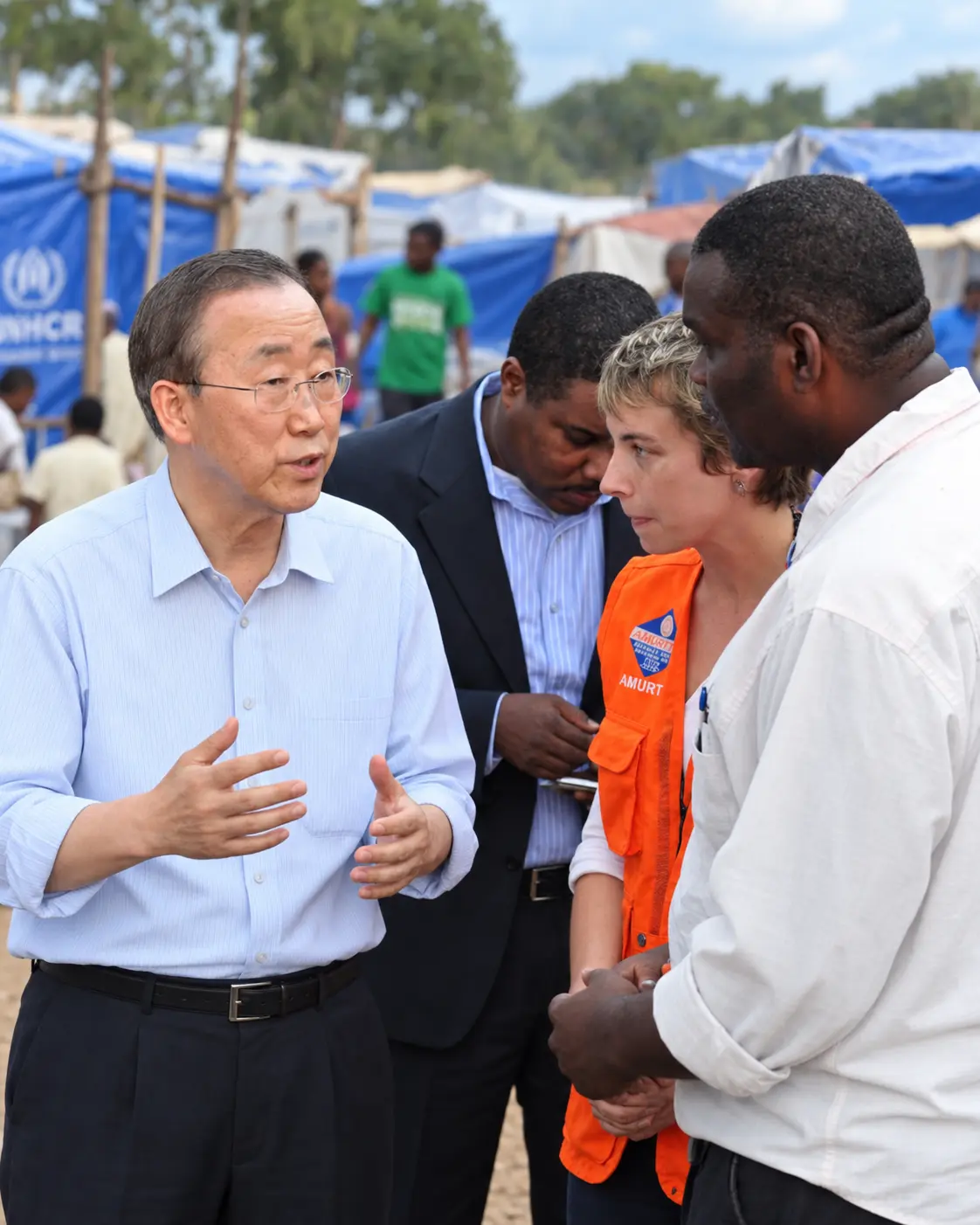 Humanitarian workers and community representatives coordinating a response