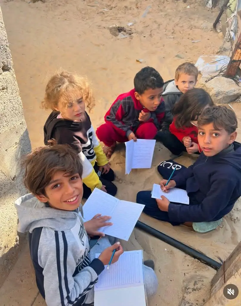 Children learning together in a community education programme in Gaza